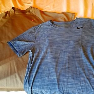 Pair of Nike dri-fit shirts